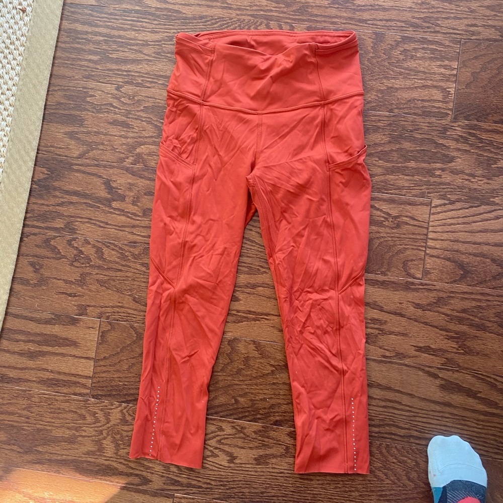 Lululemon orange invigorate crop 23’ size 4